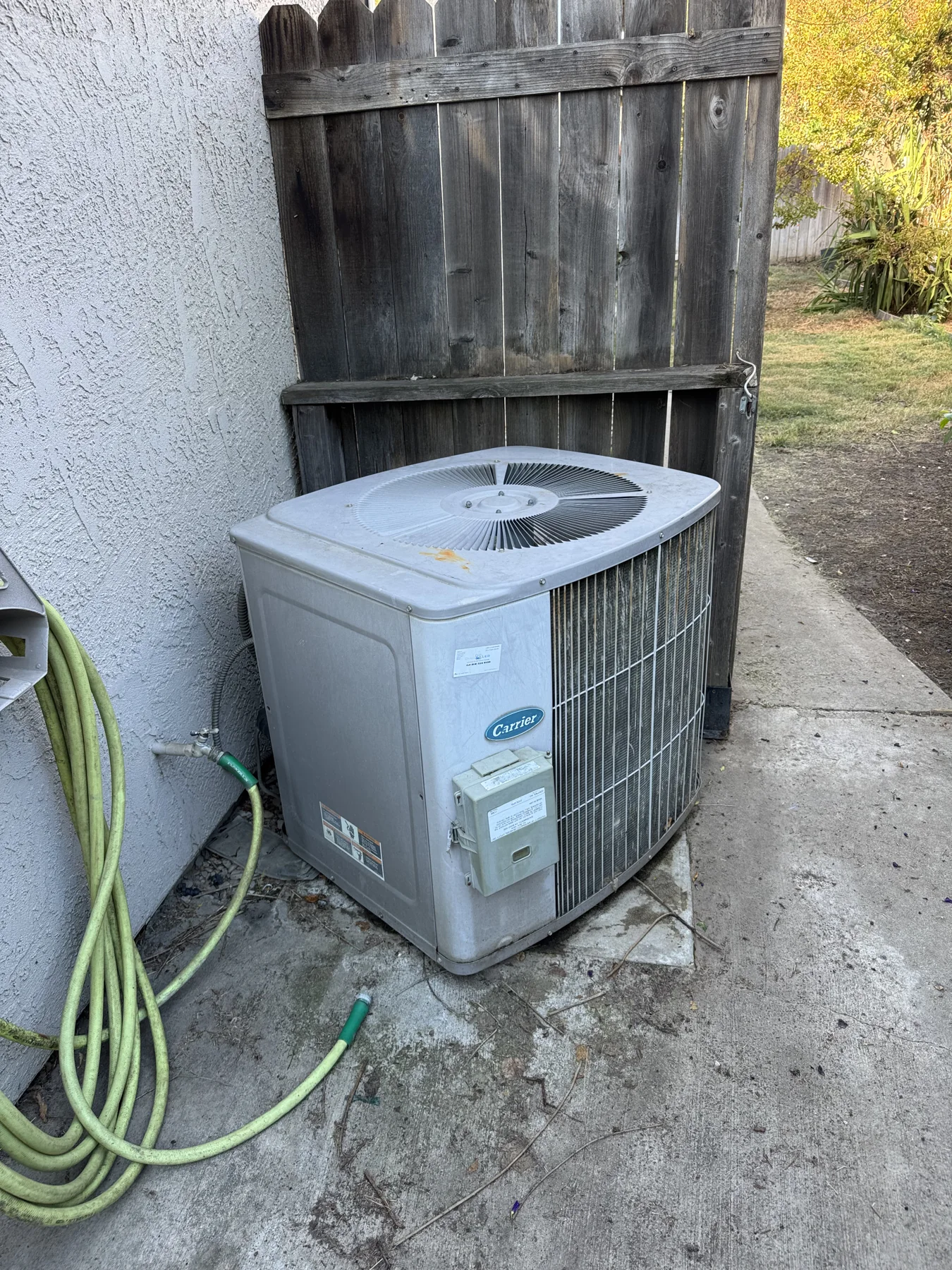 Before: existing Carrier outdoor AC at Heco's Antelope HVAC replacement project