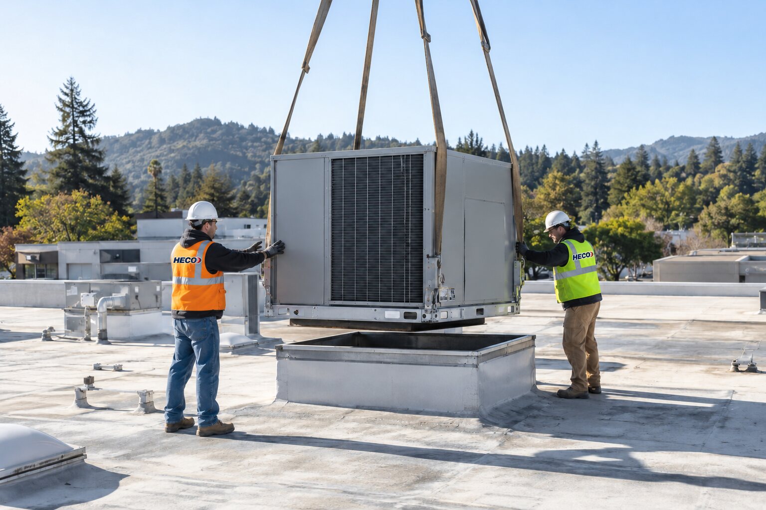 HECO crew positioning a replacement packaged rooftop HVAC unit on a commercial building