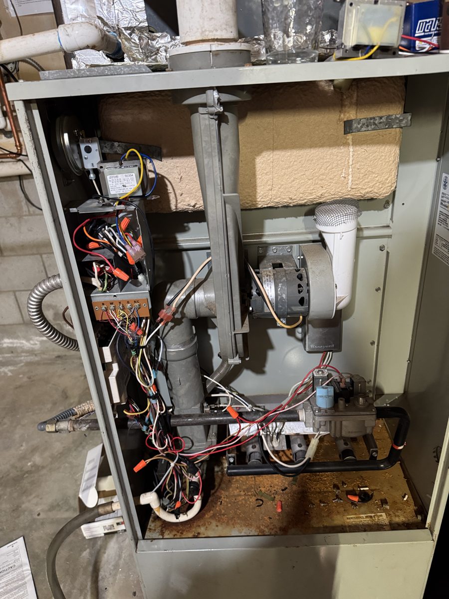 Open furnace showing components inspected during professional diagnosis
